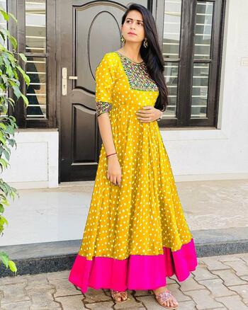 Delightful Yellow Color South Silk Printed Stitched Gown for women wear