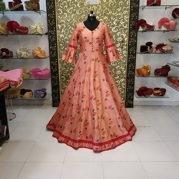 Breathtaking Orange Color Silk Flower Printed Full Stitched Gown