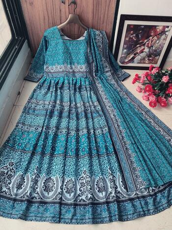 Engrossing Rama Color Butter Silk Full Stitched Digital Printed Fancy Anarkali Style Dupatta Gown For Women