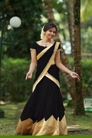 Inviting Black Tapeta Silk With Stone Work Golden Border Designer Lehenga Choli