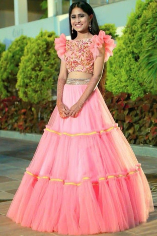 Flattering Light Pink Color Net Ruffle Lace Work Lehenga Choli For Ladies